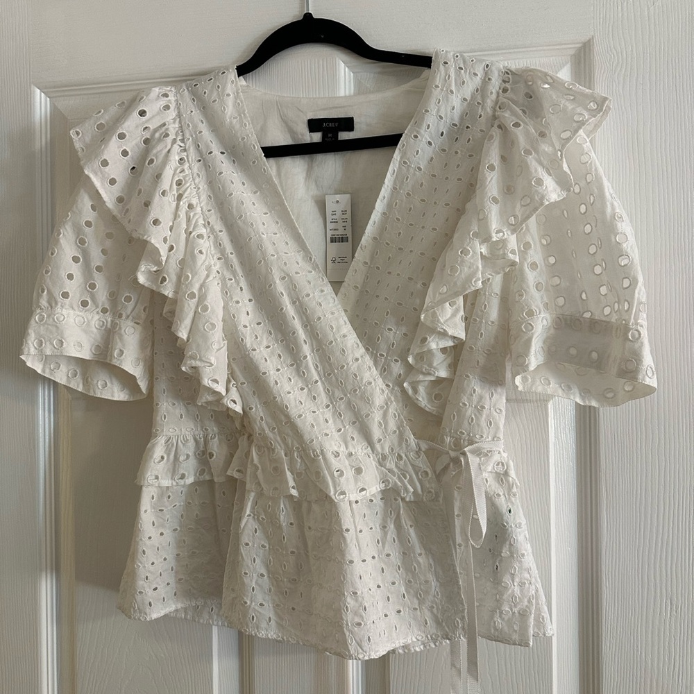 White eyelet top with puff sleeves and side tie